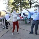 Staff dancing at a Vaccination photoshoot