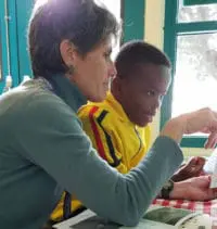 Senior tutor with young male student