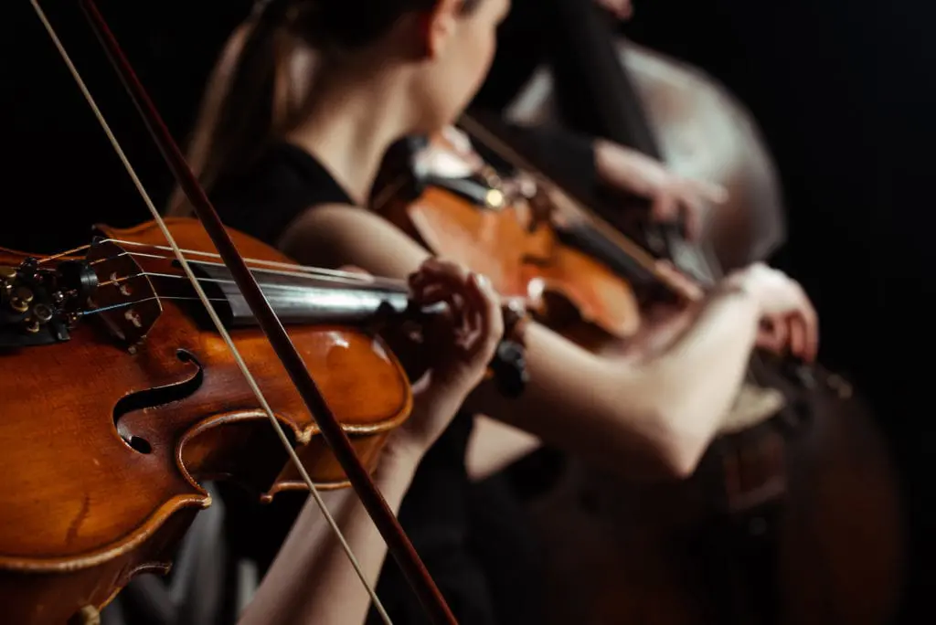 Women playing violins