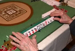 senior playing mahjong