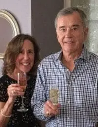 Mike and Gloria Cabral toasting with champagne glasses