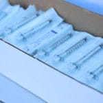 photo of a box of syringes