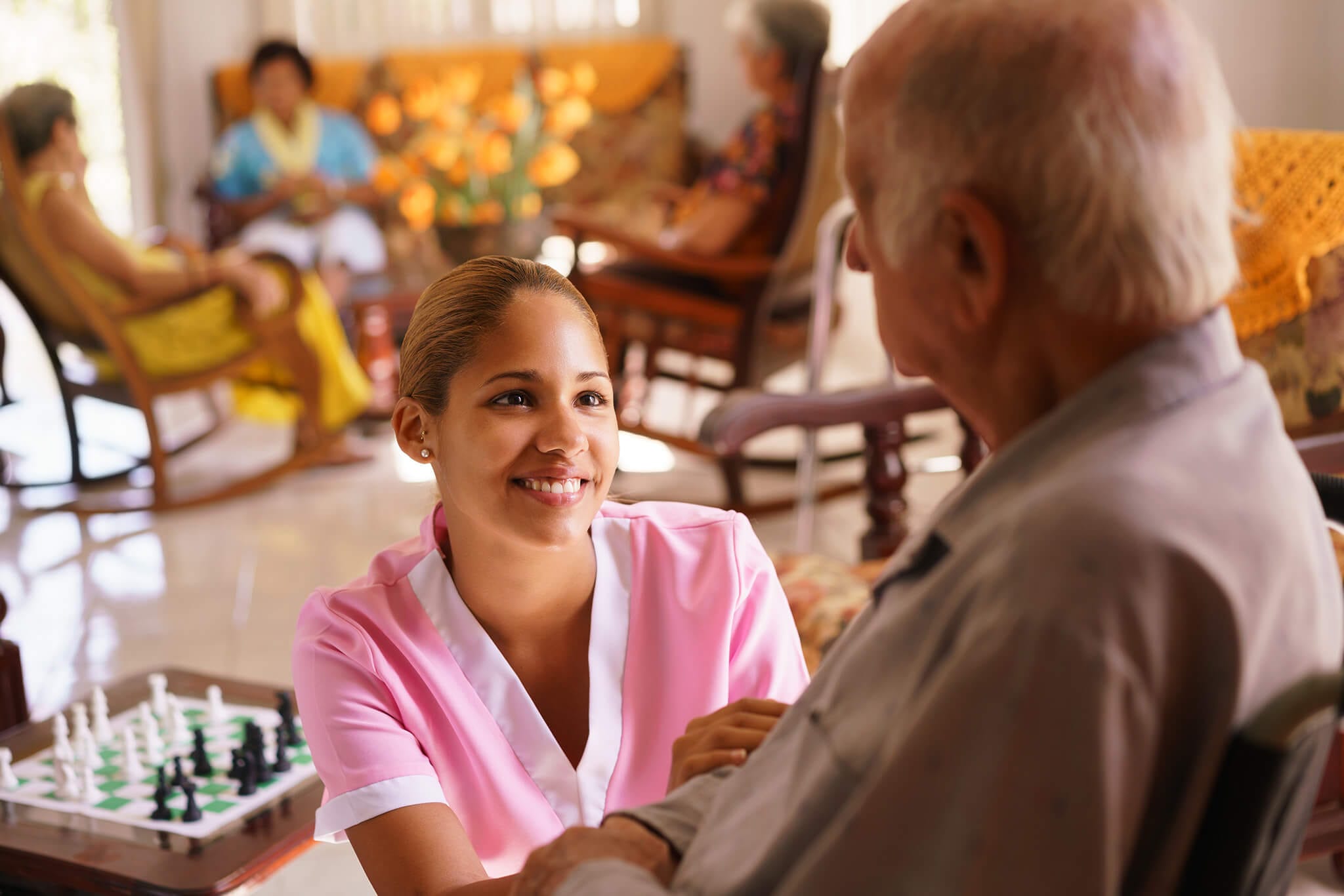 seniors | hospice | Sequoia Living. Young female caretaker helping older man