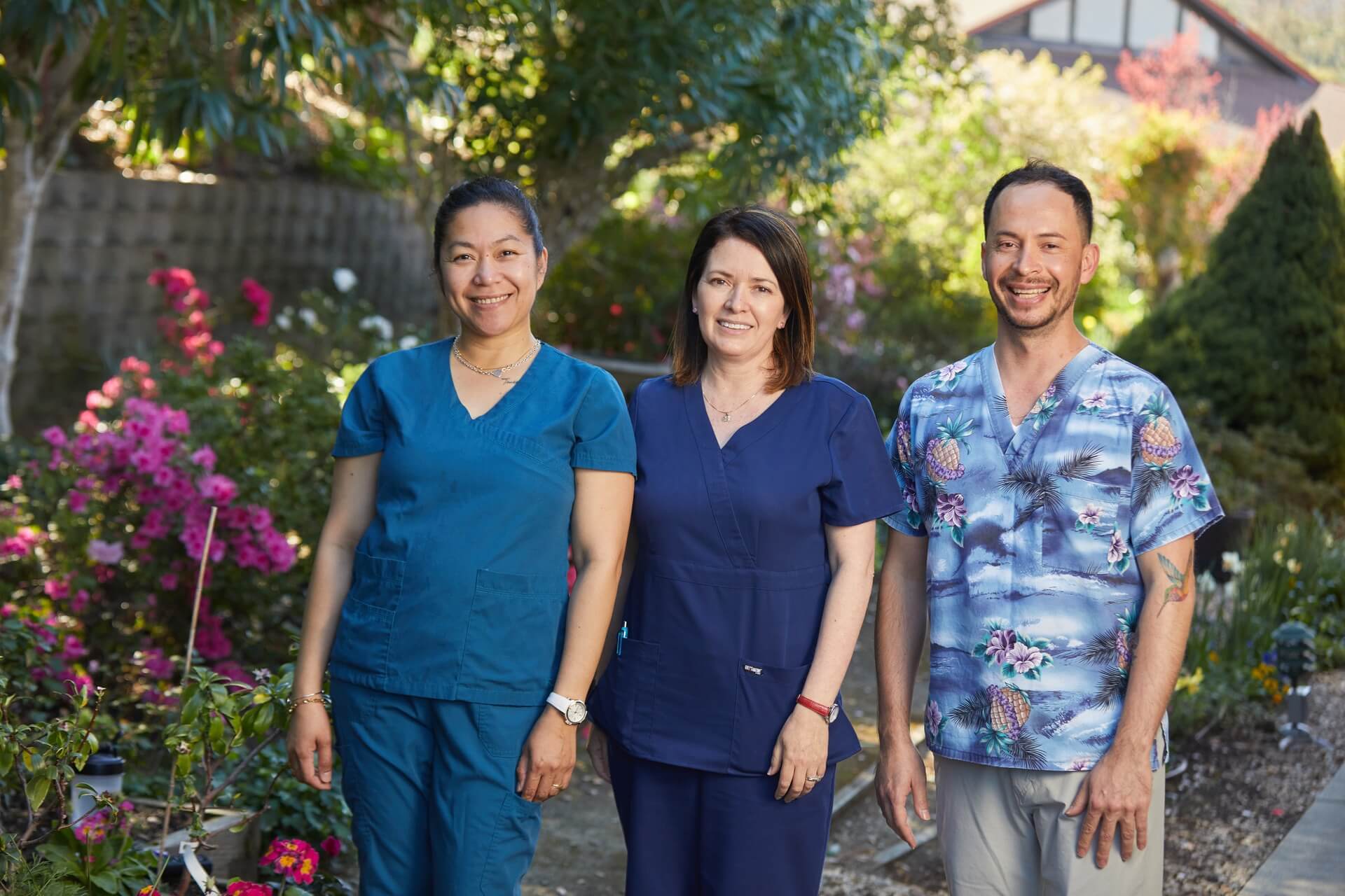 Sequoia Living Nurses Week. Group of three nurses. Two women, one man.