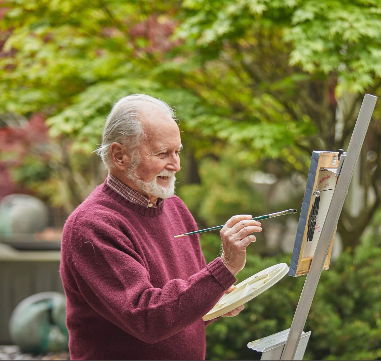 Brain Health resources. Older man painting outside.