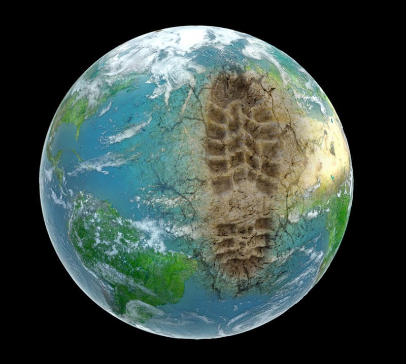 Environmental Impact. Image of earth with footprint added to it.