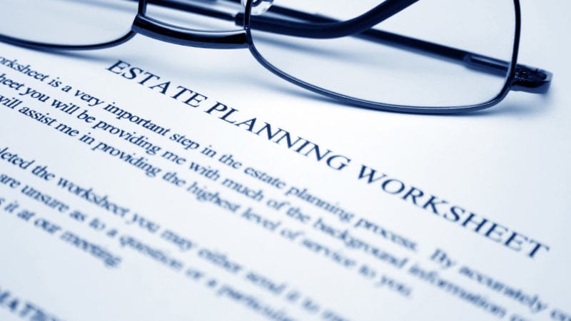 Estate Planning. Image shows a paper that says "Estate planning worksheet". And a pair of glasses on the paper.
