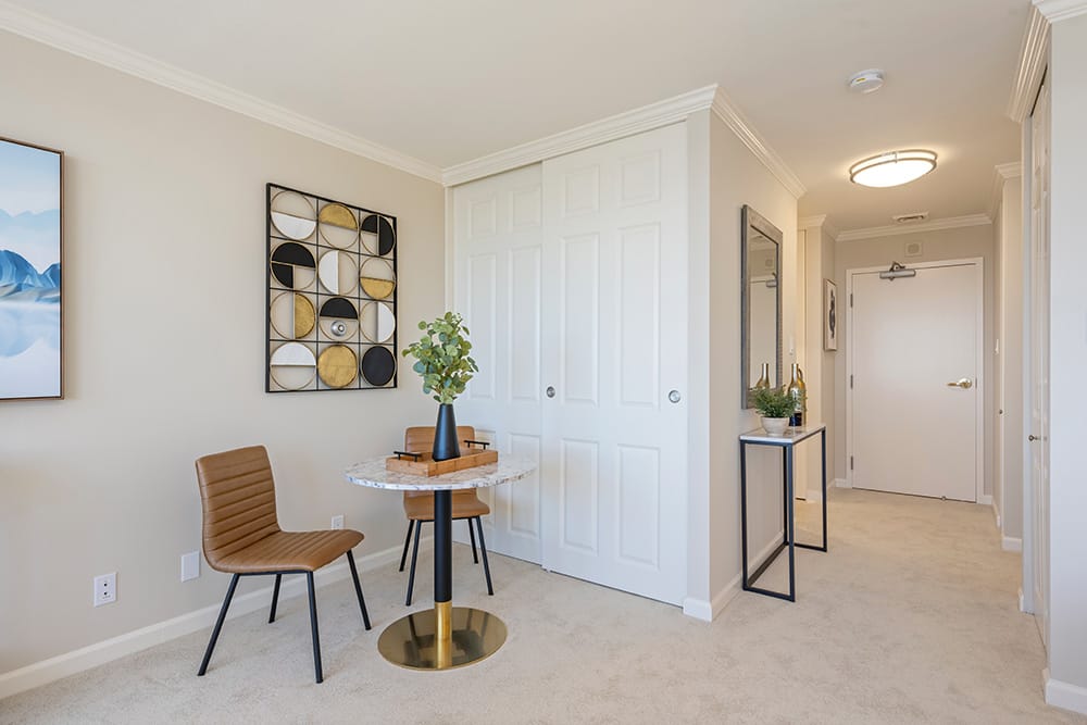 Studios at The Sequoias SF. Entranceway. White walls and doors. Off-white carpet.