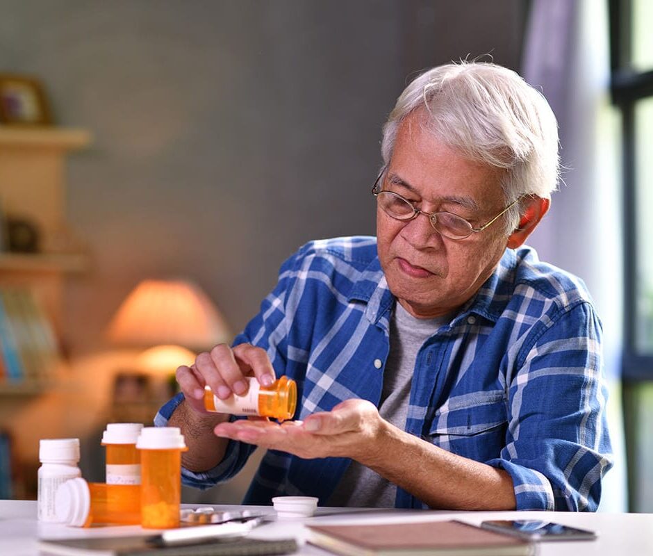 Fall Prevention | Sequoia Living Fall Prevention | Sequoia Living. Elderly man sitting down, pouring medicine from pill bottle.