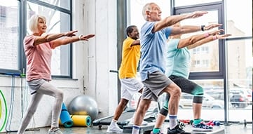 Group of elderly people working out in a gym