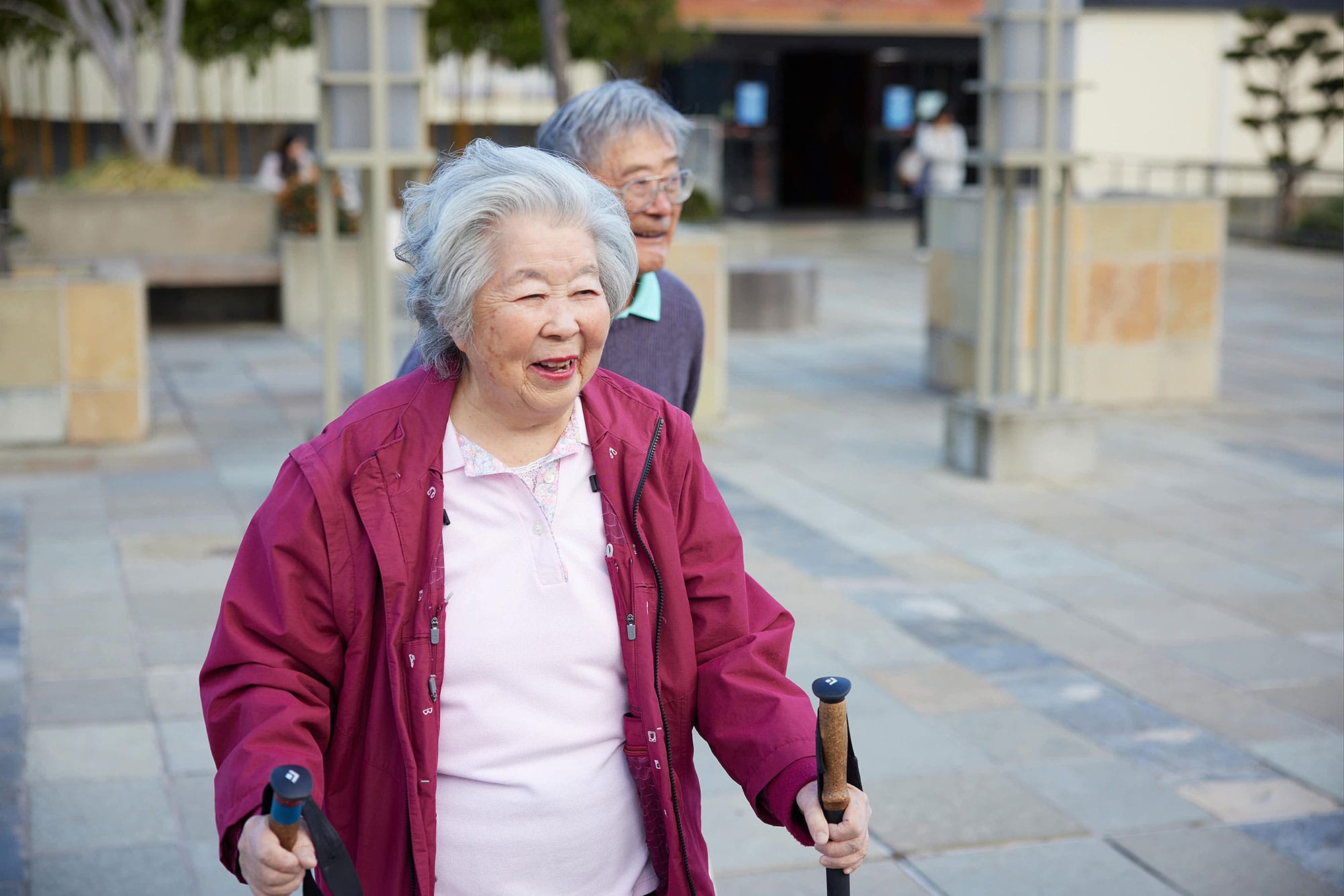 Two residents, a couple, walk around together exploring the city