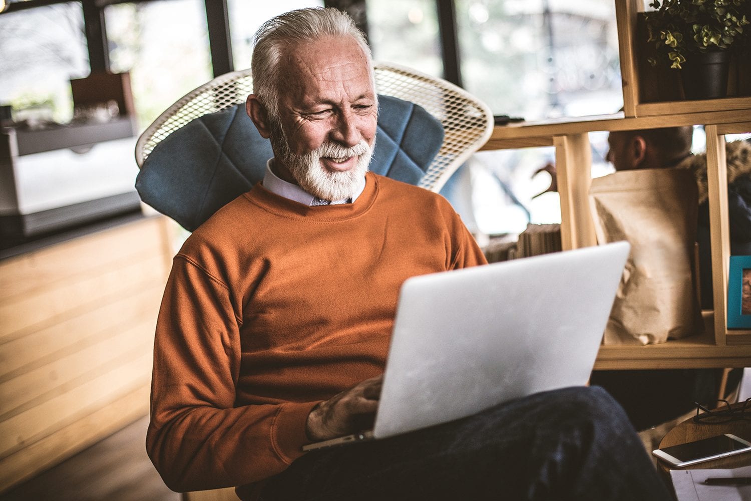 Elderly man using a laptop