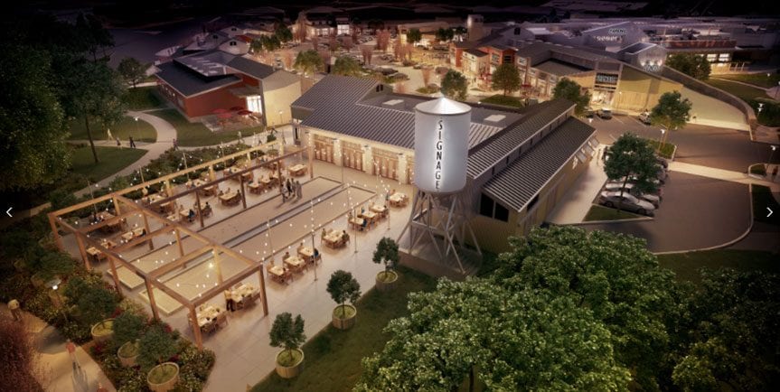 Rendering of the viamonte walnut creek's the orchards at night. A water tower next to an outdoor dining area.