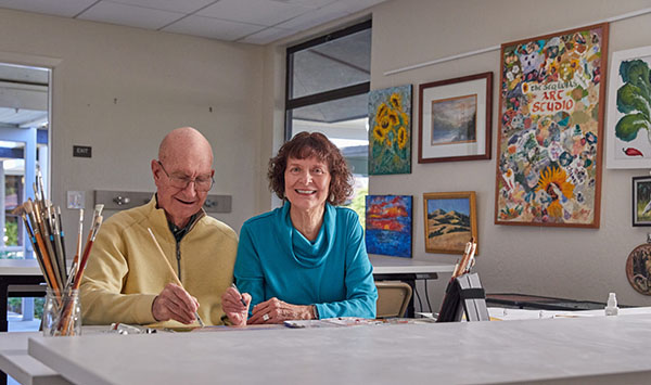 Arts at The Sequoias Portola Valley | an elderly couple sitting down and painting