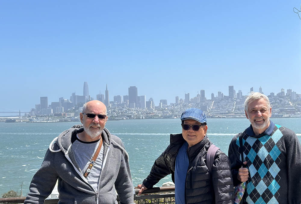Senior Center Alcatraz Tour Senior Center Alcatraz Tour - outdoors, city skyline, three men smiling
