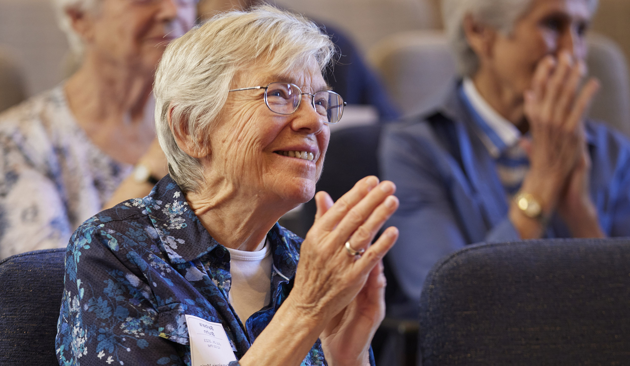 LIVE Program Announcement Sequoia Living and Buck Institute Partnership 2026, happy resident clapping, indoors