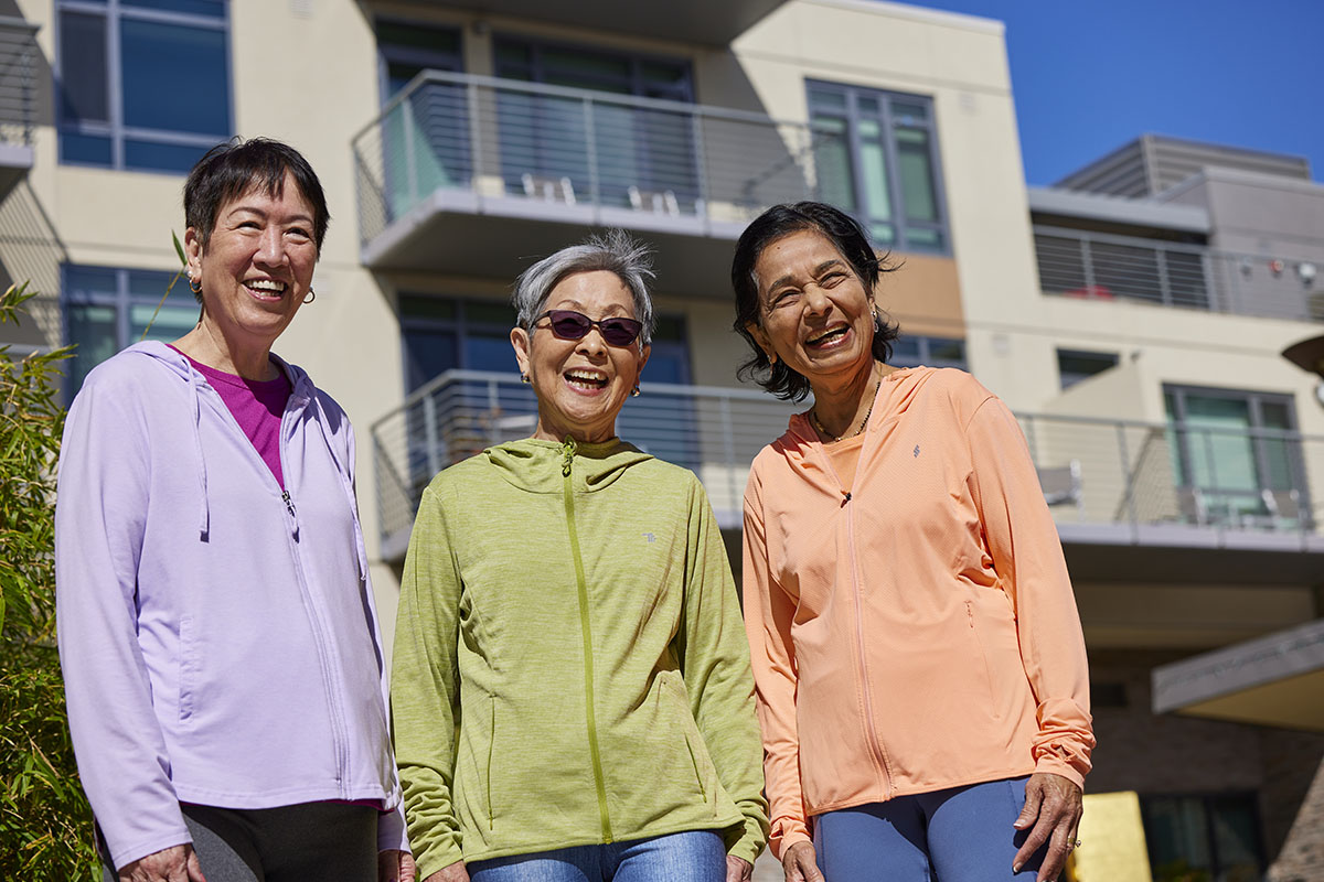 Friends and Neighbors Sequoia Living Viamonte Friends and Neighbors | three female residents of Sequoia Living Viamonte at Walnut Creek building on background, outdoors, Viamoo