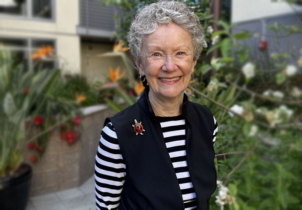 Life Plan Community Engagement | Viamonte at Walnut Creek Never Stop, female resident, standing outside happy