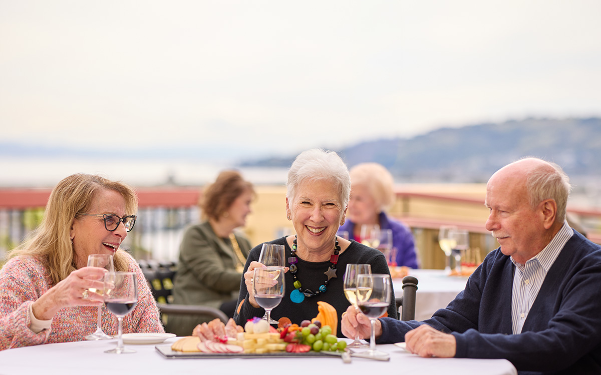 Curate Your Independence HappyHour, three happy residents outdoors