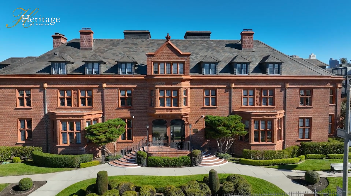 Heritage on the Marina front Front exterior of the historic Julia Morgan Building at Heritage on the Marina in San Francisco, featuring the landmark red brick senior living campus with landscaped grounds and classic early 20th century architecture.
